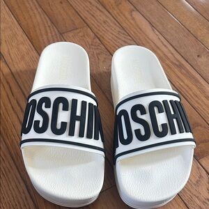 Moschino Black and White Logo Slides Original price is $235